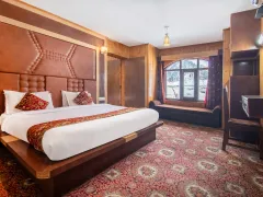Luxurious hotel bedroom with large king bed.